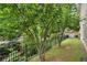 Landscaped yard with an iron fence at 1184 Medlin Se St, Smyrna, GA 30080