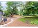 Spacious backyard with mature trees, offering a serene and private outdoor space for relaxation and entertainment at 1366 Allegheny Sw St, Atlanta, GA 30310