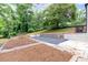 Tranquil backyard retreat, featuring stone accents and tasteful landscaping, perfect for outdoor enjoyment and relaxation at 1366 Allegheny Sw St, Atlanta, GA 30310