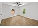 A well-lit bedroom with two windows and a ceiling fan at 1366 Allegheny Sw St, Atlanta, GA 30310