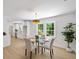 Dining area with table and chairs, hardwood flooring, and abundant natural light at 1366 Allegheny Sw St, Atlanta, GA 30310