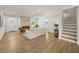 Open living room showcasing hardwood floors, fireplace, and an open staircase at 1366 Allegheny Sw St, Atlanta, GA 30310