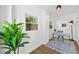 Home office with a desk, black lamp, rug, and a view to the outside at 1366 Allegheny Sw St, Atlanta, GA 30310