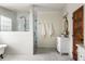 Bathroom boasts a claw foot tub, glass shower, marble floors, and an ornate vanity at 178 Mayson Ne Ave, Atlanta, GA 30307
