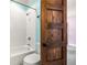 Cozy bathroom featuring a white bathtub, tiled walls, and classic fixtures at 178 Mayson Ne Ave, Atlanta, GA 30307