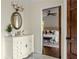 Bathroom with an ornate vanity and mirror; a sliding barn door opens to the main bedroom at 178 Mayson Ne Ave, Atlanta, GA 30307