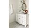 Bathroom featuring a vintage-style white vanity with black hardware and a gold-framed mirror at 178 Mayson Ne Ave, Atlanta, GA 30307
