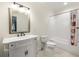 This bathroom features an updated white vanity, a mirror, and a shower at 178 Mayson Ne Ave, Atlanta, GA 30307