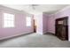 Bedroom with soft pink walls, crown molding, and decorative fireplace at 178 Mayson Ne Ave, Atlanta, GA 30307