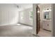 This bedroom has a connecting door to the updated bathroom with its white vanity at 178 Mayson Ne Ave, Atlanta, GA 30307