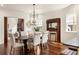 Elegant dining room with dark hardwood floors, and a vintage fireplace mantel at 178 Mayson Ne Ave, Atlanta, GA 30307