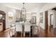 Open-concept dining room next to the kitchen with a black chandelier at 178 Mayson Ne Ave, Atlanta, GA 30307