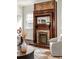 Close-up of the vintage fireplace with beautiful detailing and brick surround at 178 Mayson Ne Ave, Atlanta, GA 30307