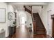 Foyer with hardwood floors, elegant staircase, and decorative mirror at 178 Mayson Ne Ave, Atlanta, GA 30307