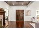 Grand foyer featuring hardwood floors, wood-paneled ceiling, and striking wooden double doors at 178 Mayson Ne Ave, Atlanta, GA 30307