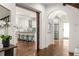 Open-concept with island seating, white cabinetry, and eye-catching backsplash, seamlessly connecting living spaces at 178 Mayson Ne Ave, Atlanta, GA 30307