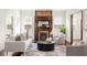 Inviting living room featuring a vintage fireplace, hardwood floors, and a comfortable seating area at 178 Mayson Ne Ave, Atlanta, GA 30307