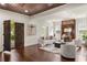 Bright living room with hardwood floors, white walls, vintage fireplace and statement double doors at 178 Mayson Ne Ave, Atlanta, GA 30307
