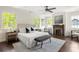 Bright main bedroom features a fireplace, ceiling fan, neutral decor and plenty of natural light at 178 Mayson Ne Ave, Atlanta, GA 30307