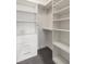 Walk-in closet featuring ample shelving and drawer storage for organization at 178 Mayson Ne Ave, Atlanta, GA 30307