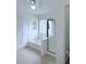 Bright bathroom featuring a tub, glass-enclosed shower, and window at 1991 Westover Nw Ln, Kennesaw, GA 30152