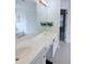 Bathroom featuring double vanity, large mirror, and modern lighting at 1991 Westover Nw Ln, Kennesaw, GA 30152