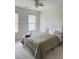 Bedroom with carpet, windows, ceiling fan, and neutral decor at 1991 Westover Nw Ln, Kennesaw, GA 30152