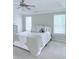 Bright bedroom featuring a ceiling fan, neutral walls, and plush bedding for ultimate comfort at 1991 Westover Nw Ln, Kennesaw, GA 30152