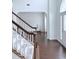Bright foyer featuring dark wood floors, a staircase, and a view into the living area at 1991 Westover Nw Ln, Kennesaw, GA 30152