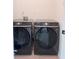 Laundry room with front load Samsung washer and dryer at 1991 Westover Nw Ln, Kennesaw, GA 30152