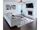 Modern living room with a fireplace, a large comfortable sofa, and stylish decor at 1991 Westover Nw Ln, Kennesaw, GA 30152