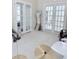 Bright room featuring double french doors, neutral carpet, toys, and recreational equipment at 1991 Westover Nw Ln, Kennesaw, GA 30152