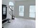 Spacious living area with arched entryway and two windows bringing in lots of natural light at 1991 Westover Nw Ln, Kennesaw, GA 30152