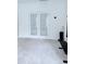 Bright living room featuring French doors and neutral carpet, offering a versatile living space at 1991 Westover Nw Ln, Kennesaw, GA 30152