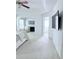 Spacious primary bedroom with fan, sitting area, fireplace, and ensuite bathroom at 1991 Westover Nw Ln, Kennesaw, GA 30152