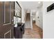 Inviting foyer with hardwood floors, a console table, and a staircase leading to the upper level at 2357 Heritage Park Nw Cir # 17, Kennesaw, GA 30144