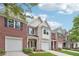 These new townhomes feature brick facades, attached garages, and fresh landscaping at 2357 Heritage Park Nw Cir # 17, Kennesaw, GA 30144