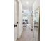 Hallway leading to a bedroom with a view of the bed and furniture through an open doorway at 2357 Heritage Park Nw Cir # 17, Kennesaw, GA 30144