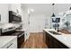 Spacious kitchen with a dark wood island, stainless steel appliances, and an open view to the living room at 2357 Heritage Park Nw Cir # 17, Kennesaw, GA 30144