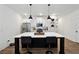 Kitchen featuring an island with bar seating, stainless steel appliances, and bright, modern lighting at 2357 Heritage Park Nw Cir # 17, Kennesaw, GA 30144