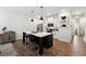 Kitchen featuring an island with bar seating, stainless steel appliances, and bright, modern lighting at 2357 Heritage Park Nw Cir # 17, Kennesaw, GA 30144