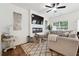 Bright living room with a modern fireplace, ceiling fan and plush seating area at 2357 Heritage Park Nw Cir # 17, Kennesaw, GA 30144