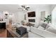 Open living area with a modern fireplace, lots of natural light, and ceiling fan at 2357 Heritage Park Nw Cir # 17, Kennesaw, GA 30144