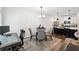 Open-concept living space with modern kitchen, dining area, and home office space at 2357 Heritage Park Nw Cir # 17, Kennesaw, GA 30144