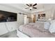 This main bedroom has a ceiling fan, TV, and barn door access to a wardrobe at 2357 Heritage Park Nw Cir # 17, Kennesaw, GA 30144