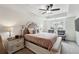 Serene main bedroom featuring a tray ceiling, cozy seating, and ample natural light at 2357 Heritage Park Nw Cir # 17, Kennesaw, GA 30144