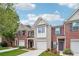 Charming brick townhome featuring a one-car garage, well-maintained lawn, and inviting curb appeal at 2357 Heritage Park Nw Cir # 17, Kennesaw, GA 30144