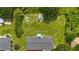 An aerial shot of the home with spacious backyard including a storage shed surrounded by mature trees at 5488 Janice Ln, Stone Mountain, GA 30087