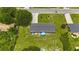 Aerial view of home with large backyard, red deck, and mature trees at 5488 Janice Ln, Stone Mountain, GA 30087