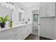 Bright bathroom with double vanity, modern fixtures, and a separate water closet at 5488 Janice Ln, Stone Mountain, GA 30087